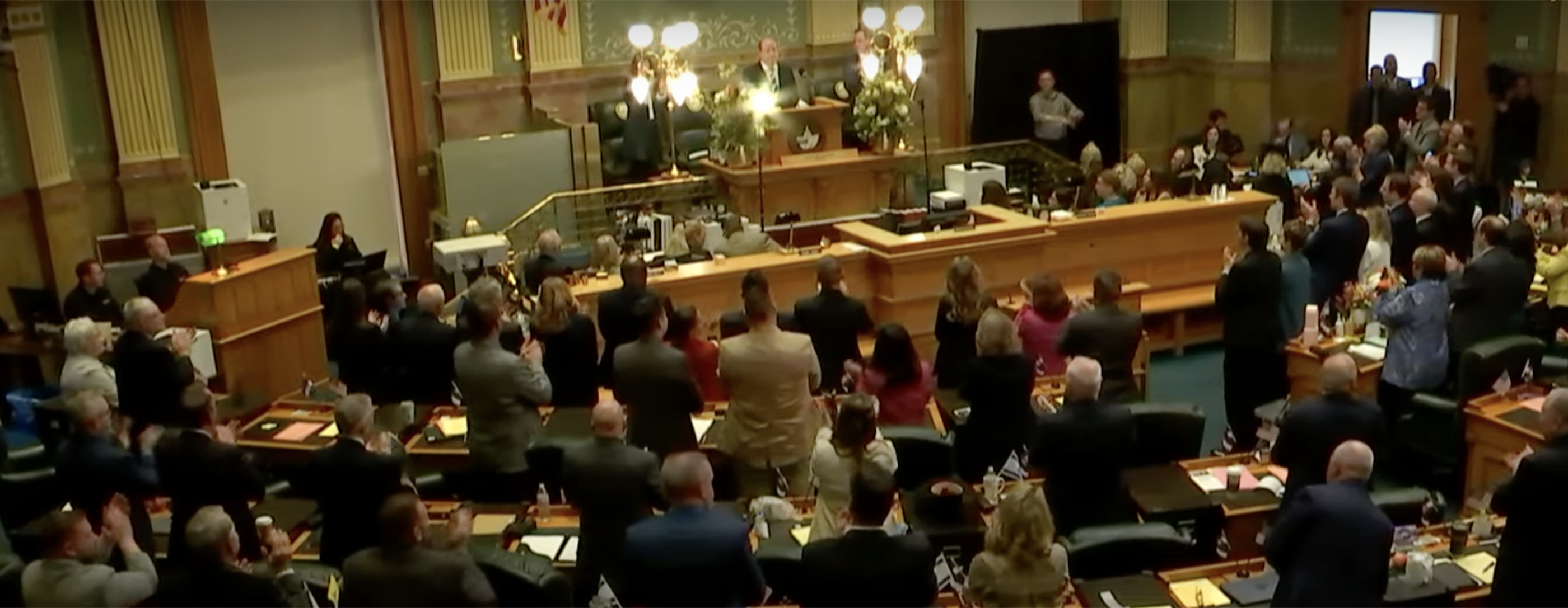 Audience members applaud Governor Jared Polis during his State of the State speech Jan. 11 in the House chamber.