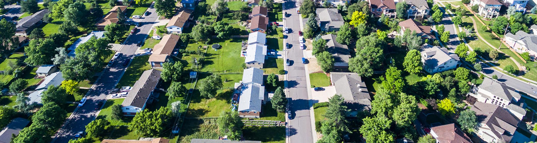 An aerial photo of a neighborhood showing parallel streets lined with houses