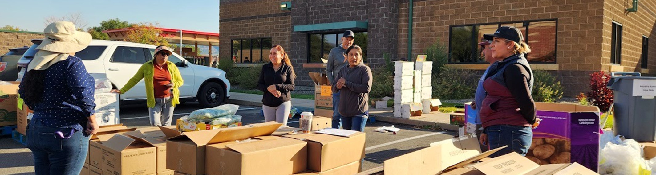 Safe and Abundant Nutrition Alliance (SANA) at a food distribution event.