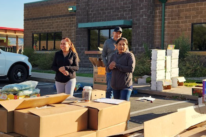 Safe and Abundant Nutrition Alliance (SANA) at a food distribution event.