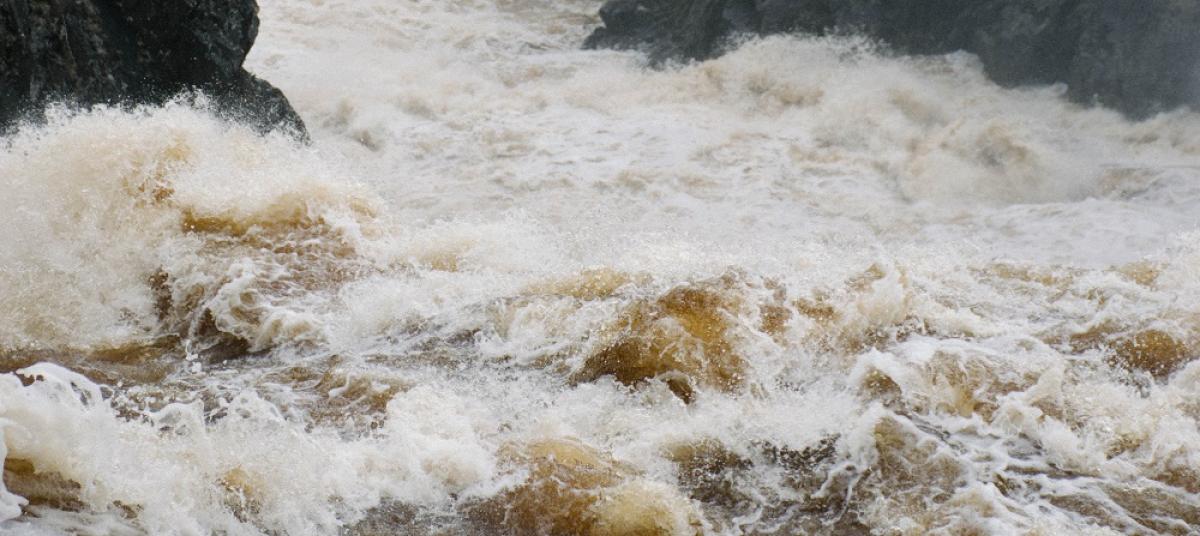 Flood waters overwhelm a canyon stream