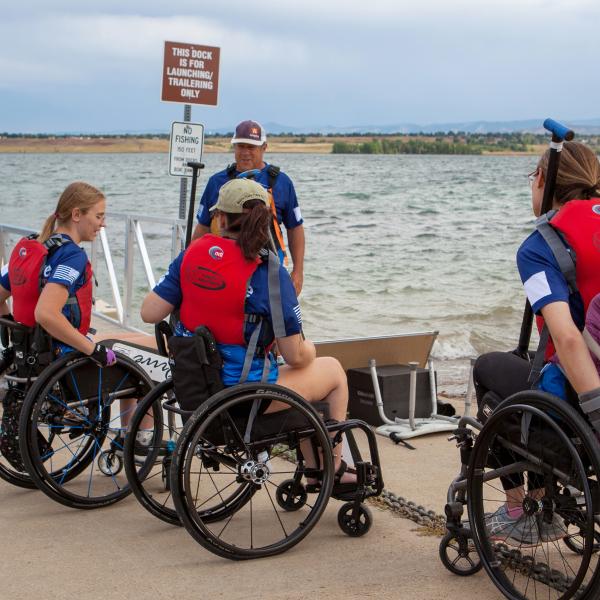 From left, Claire Thomas, Liz Mahoney, Bob Nelson, and Alison Rehfus line up to load into the Team Blue boat.