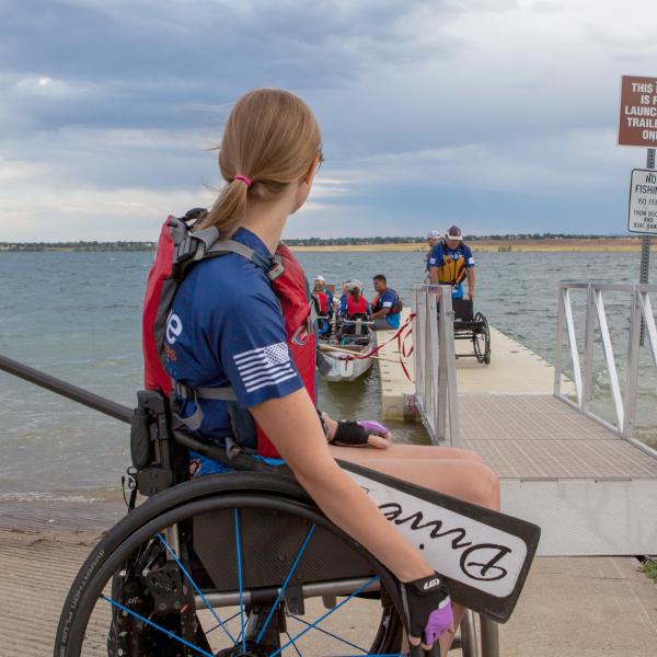 Claire Thomas waits to join her fellow adaptive athletes on the Team Blue dragon boat.