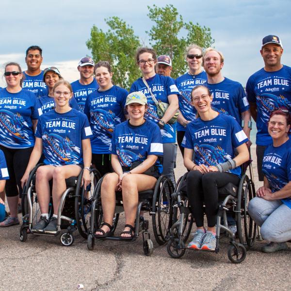 Team Blue dragon boat members gather following a practice at Standley Lake in Westminster.